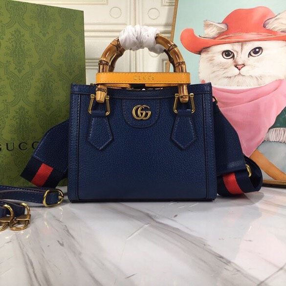 G*u*i top handle bags